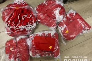 В Запорожье мужчина изготавливал георгиевские ленты и маски с символикой СССР