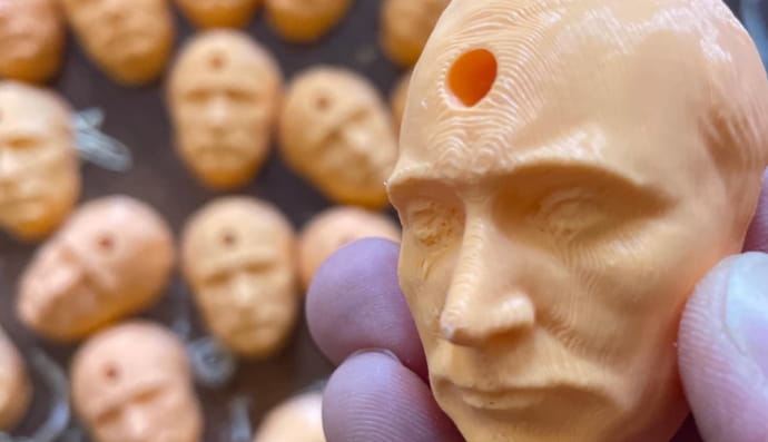 Кришки з головою путіна 